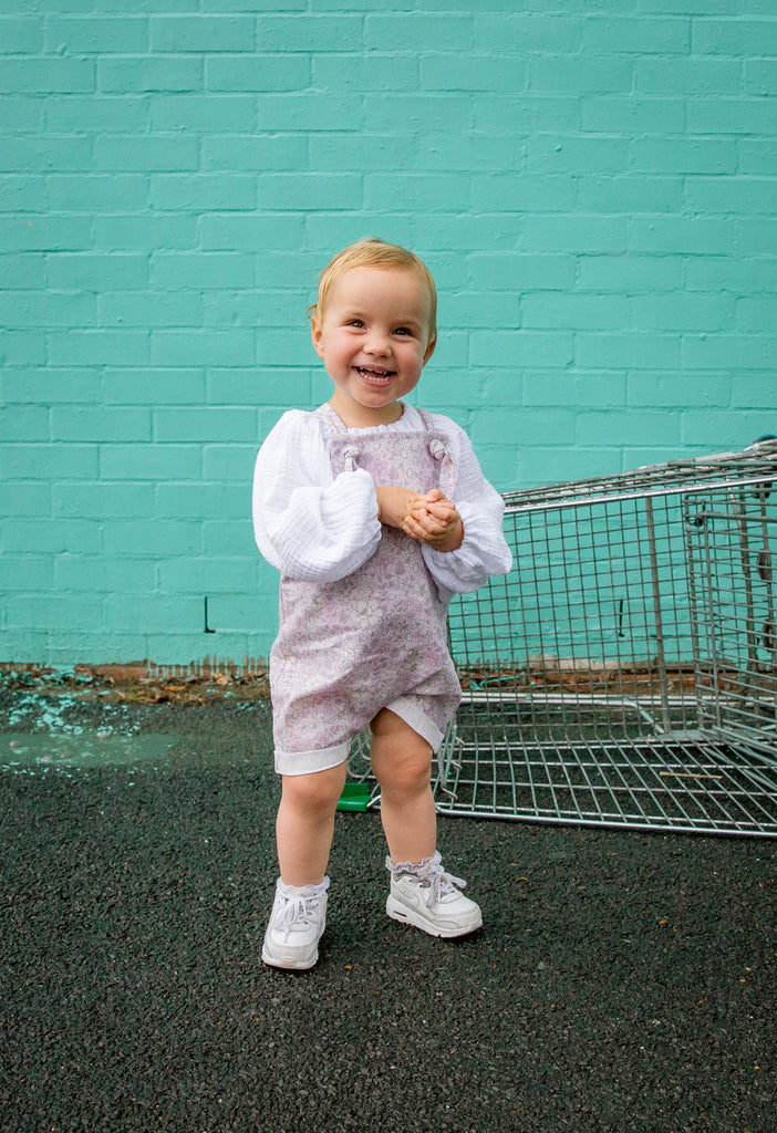 Handmade in Coffs Harbour, NSW, Australia, these lavender, mauve and white ‘purple haze’ overalls have been thoughtfully designed for growing children. Made with a gusset crutch for a comfy fit and adjustable tie shoulder straps for prolonged wear. 