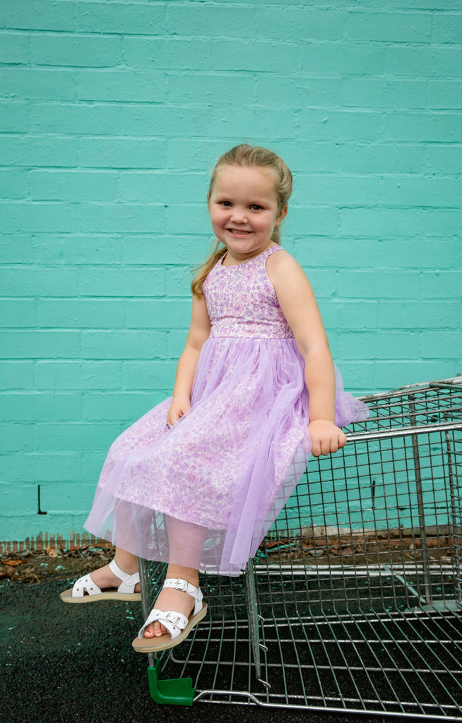 Made for fun and perfect for both dressy and casual occasions, our Growbabyco peplum dresses are timelessly adorable. With adjustable crossover straps and an elastic back for the perfect fit.
Handmade in Coffs Harbour, NSW, Australia.
Our handmade dresses are made with a soft linen in our lilac, lavender, purple ‘purple aglow’ print fabric and layered with tulle.
All designs are small batch, with only a handful produced each batch 
.