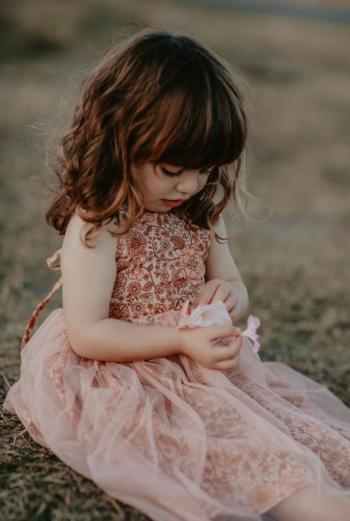 Made for fun and perfect for both dressy and casual occasions, our Growbabyco peplum dresses are timelessly adorable. With adjustable crossover straps and an elastic back for the perfect fit.
Handmade in Coffs Harbour, NSW, Australia.
Our handmade dresses are made with a soft linen in our peach, pink and tan ‘bloom’ print fabric and layered with tulle.
All designs are small batch, with only a handful produced each batch 
.