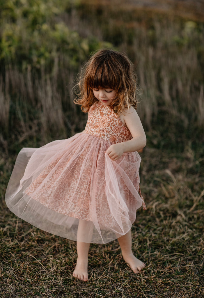 Made for fun and perfect for both dressy and casual occasions, our Growbabyco peplum dresses are timelessly adorable. With adjustable crossover straps and an elastic back for the perfect fit.
Handmade in Coffs Harbour, NSW, Australia.
Our handmade dresses are made with a soft linen in our peach, pink and tan ‘bloom’ print fabric and layered with tulle.
All designs are small batch, with only a handful produced each batch 
.