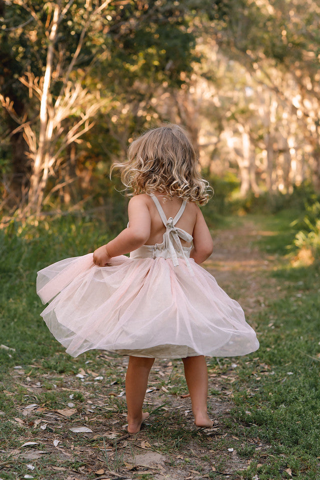 Made for fun and perfect for both dressy and casual occasions, our Growbabyco peplum dresses are timelessly adorable. With adjustable crossover straps and an elastic back for the perfect fit.
Handmade in Coffs Harbour, NSW, Australia.
Our handmade dresses are made with a soft oatmeal linen and layered with pink tulle.
All designs are small batch, with only a handful produced each batch 
.