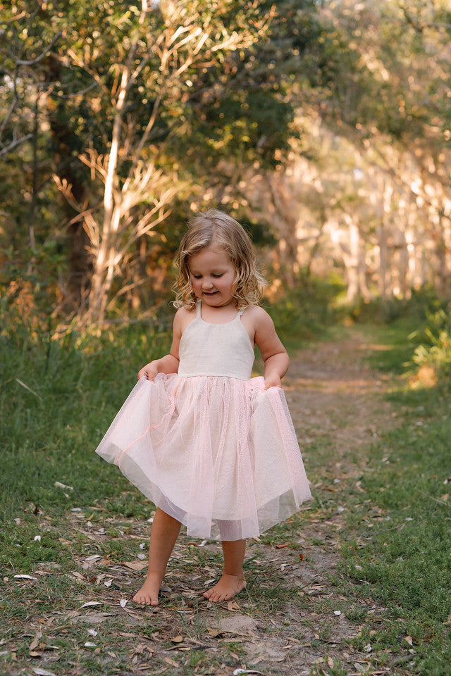 Made for fun and perfect for both dressy and casual occasions, our Growbabyco peplum dresses are timelessly adorable. With adjustable crossover straps and an elastic back for the perfect fit.
Handmade in Coffs Harbour, NSW, Australia.
Our handmade dresses are made with a soft oatmeal linen and layered with tulle.
All designs are small batch, with only a handful produced each batch 
.