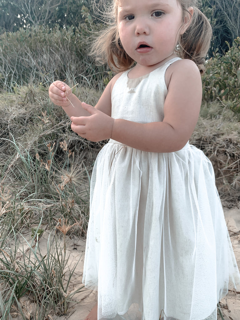 Made for fun and perfect for both dressy and casual occasions, our Growbabyco peplum dresses are timelessly adorable. With adjustable crossover straps and an elastic back for the perfect fit.
Handmade in Coffs Harbour, NSW, Australia.
Our handmade dresses are made with a soft oatmeal linen and layered with white tulle.
All designs are small batch, with only a handful produced each batch 
.