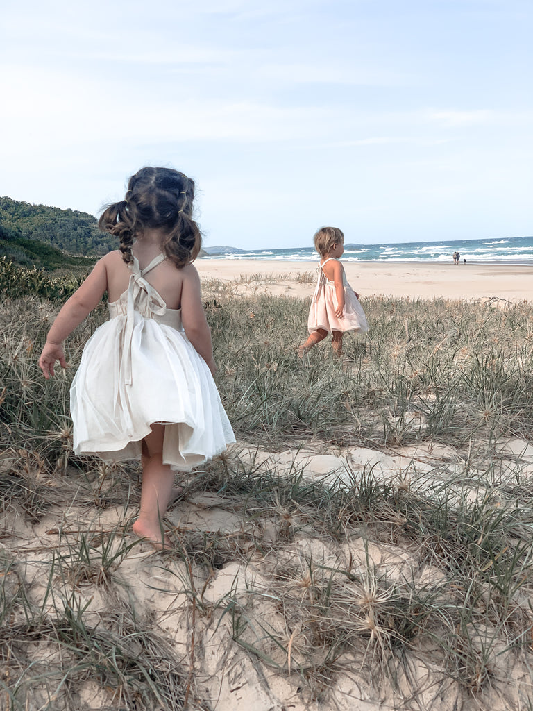 Made for fun and perfect for both dressy and casual occasions, our Growbabyco peplum dresses are timelessly adorable. With adjustable crossover straps and an elastic back for the perfect fit.
Handmade in Coffs Harbour, NSW, Australia.
Our handmade dresses are made with a soft oatmeal linen and layered with white tulle.
All designs are small batch, with only a handful produced each batch 
.