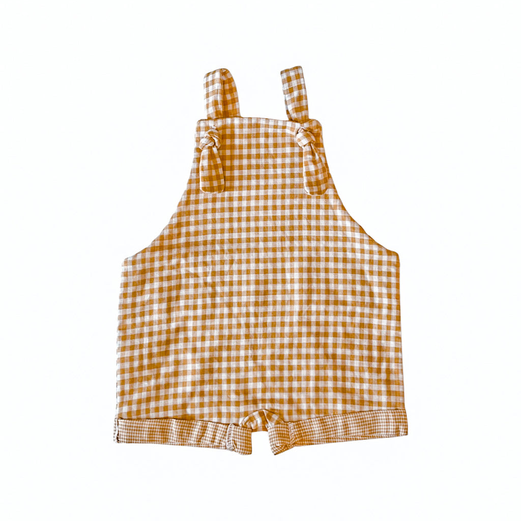 Handmade in Coffs Harbour, NSW, Australia, these mustard gingham overalls have been thoughtfully designed for growing children. Made with a gusset crutch for a comfy fit and adjustable tie shoulder straps for prolonged wear. 