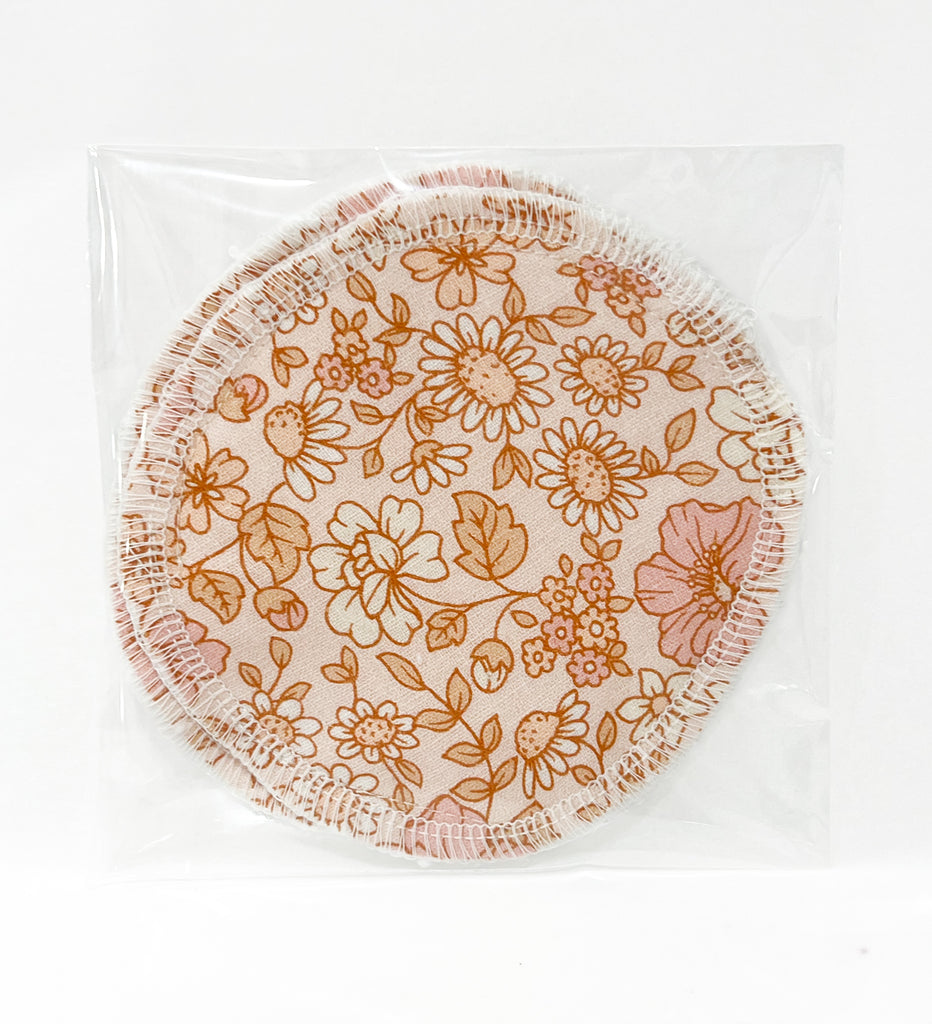 Round reusable breast pads featuring an exclusive fabric print outer layer. 
Designed with a leakproof PUL layer and a soft bamboo terry backing for maximum comfort and absorption, these pads measure 11cm across.