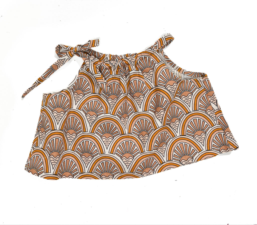 Made for fun and perfect for both dressy and casual occasions. 

Handmade in Coffs Harbour, NSW, these tie-top swing tops have been thoughtfully designed for growing children, with a fully adjustable neckline.

Our handmade swing tie tops are made with a soft beige, muted orange and white ‘sunrise’ print on linen that will just get better with wear and age.