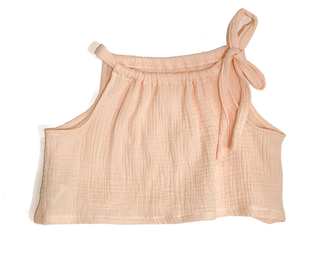 Made for fun and perfect for both dressy and casual occasions. 

Handmade in Coffs Harbour, NSW, these tie-top swing tops have been thoughtfully designed for growing children, with a fully adjustable neckline.

Our handmade swing tie tops are made with a soft peach ‘gelato’ muslin that will just get better with wear and age.
